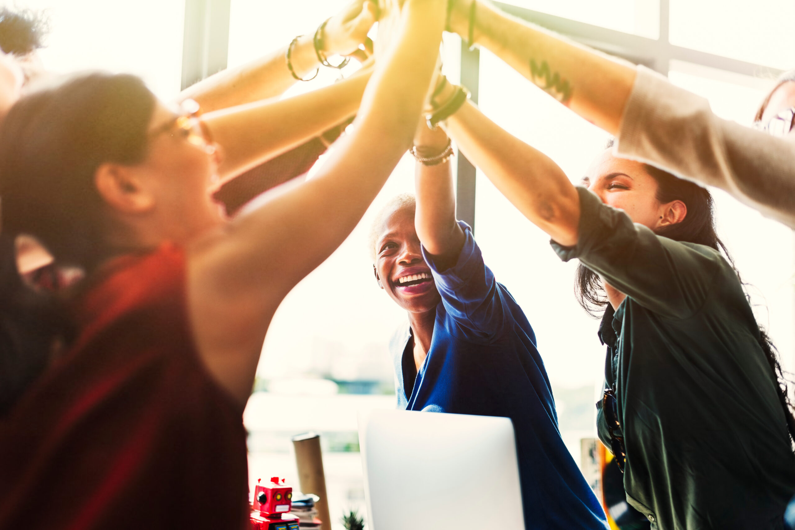 group of women celebrating best staffing firms for women