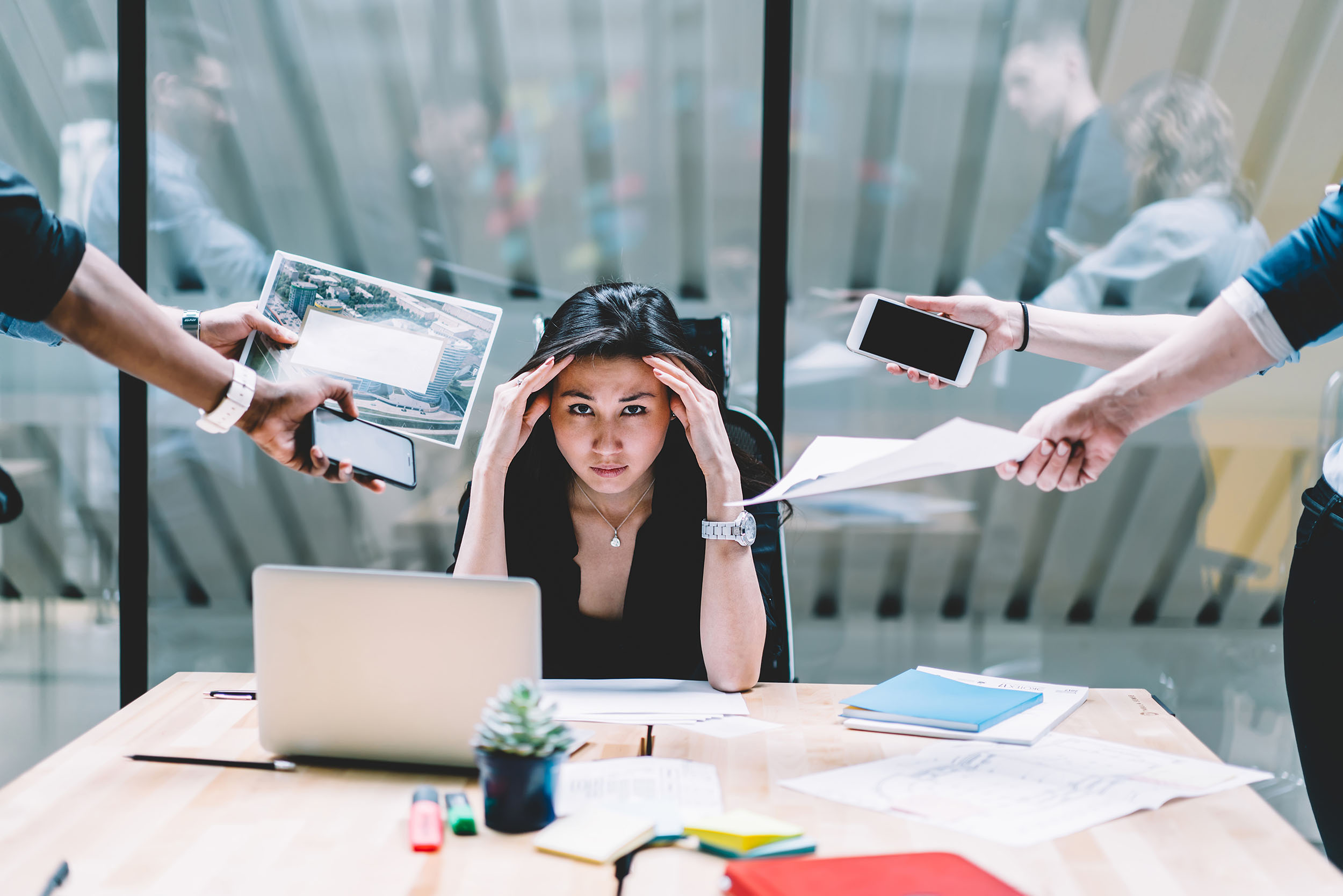 woman who is overwhelmed with work